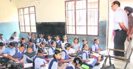 Benches continue to be a rare luxury at the Government Middle School in Indira Colony, where a majority of students are forced to sit on dirty durees and taats.