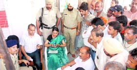 Shopkeepers interact with senior administative officials and the police during an anti-encroachment drive in old Panchkula on Tuesday.