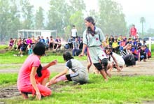 A kho-kho match in progress during a district-level competition in Dehradun on Tuesday. 