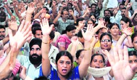 Employees hold a protest in front of GGM Science College.