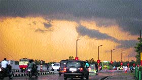 Commuters back on the road after a downpour in Jammu on Tuesday.