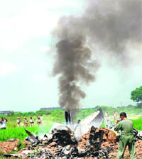 The smouldering wreckage of a MiG that crashed in therr fields of a village near Rajpura on Tuesday.