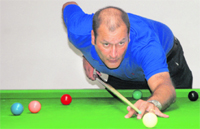 A player takes an aim during a snooker championship in Chandigarh on Wednesday
