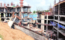 The collapsed wing of the upcoming air-conditioned bus stand-cum-commercial complex in Sector 57 (Phase VI) along the Chandigarh-Kharar section of National Highway-21 in Mohali