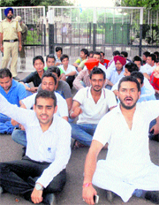 PUSU members stage a dharna outside the Vice-Chancellors office in Panjab University