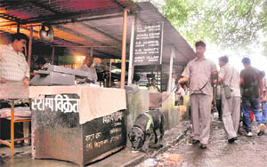 The police conducts a search in the Dehradun District Courts complex following a bomb blast outside the Delhi High Court on Wednesday. 