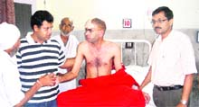 Bijender recovers in a ward at the PGIMS, Rohtak, after a complex brain surgery. 