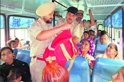 Cops check luggage in a bus at Karnal on Wednesday. 