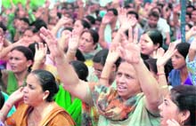 Members of the Joint Consultative Committee hold a protest in Jammu on Wednesday