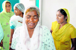 Joginder Kaur. mother of Gurmeet Kaur, who was allegedly set ablaze by her in-laws, weeps outside her room in a hospital in Amritsar