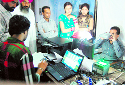 People waiting for the Unique Identifcation Number at a temporary centre in Amritsar