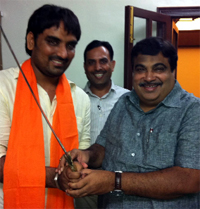 BJP president Nitin Gadkari presenting a sword to Gurparvez Shelly who has been appointed a national secretary of the Bharatiya Janata Yuva Morcha (BJYM). Ferozepur- based Shelly was earlier the BJYM state chief