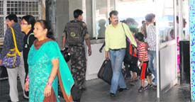 Passengers move freely at the entrance to the Chandigarh railway station.