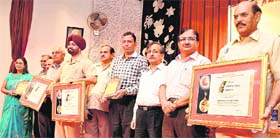 Awardees strike a pose at the annual day celebrations of the National Institute of Technical Teachers Training and Research in Chandigarh.