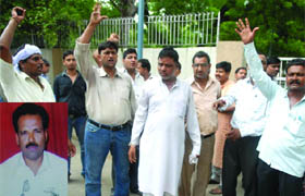 Relatives of Pramod Chaurasia (inset), who died in the blast, protest outside the mortuary of Lady Hardinge Hospital in New Delhi on Thursday.