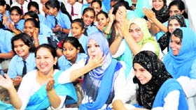 A group of Kashmiri girls appreciates the performance of Kashmiri folk dance artistes at MKP Girls College in Dehradun on Thursday.