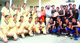The teams of Welham Girls School and Welham Boys School that won the District Basketball Championship for girls and boys in Dehradun on Thursday.