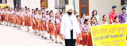 Students of St Soldiers Divine Public School take out a rally to promote eye donation in Jalandhar on Thursday. 