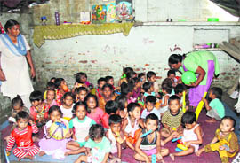 Children at a makeshift creche being run by NGO Pahal in Indira Colony in Jalandhar.