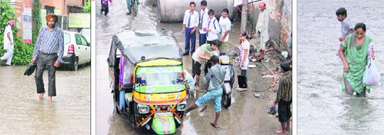 Civil Surgeons office flooded with rainwater disrupts normal routine; a youth helps a girl start her two-wheeler which broke down at Domoria Bridge due to rain; and a woman and a child wade through a flooded road in Ludhiana on Thursday