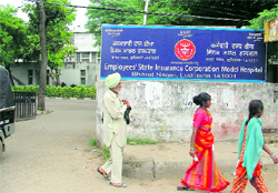 Patients come out of the ESI Corporation Model Hospital in Ludhiana