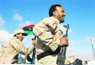 Anti-Gaddafi fighters prepare to advance towards the besieged Libyan town of Bani Walid.