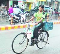 A boy delivers tiffins of home-cooked food in Amritsar.