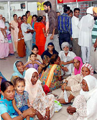 A large number of people await their turn before the counters at the GPO in the civil station area in Bathinda. 