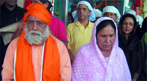 Brahmrishi Kumar Swami, his wife and Hema Malini during the inauguration of a charitable hospital in the border town Srikaranpur in Rajasthan on Friday. 