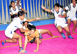 Players of Dev Samaj College ,Sector 45, Chandigarh, and Dev Samaj College, Ferozepur, slug it out during the final of Inter-College Women Kabaddi Tournament at Panjab University in Chandigarh on Friday