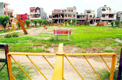 The park in front of house 109 at Sector 78 in Mohali, which has been provided with benches, play equipment, mild steel railing and a walkway by GMADA