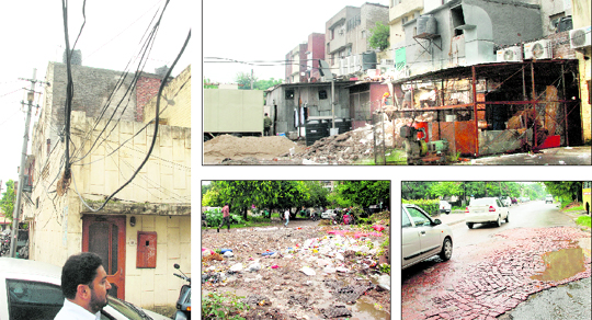 Loose electricity wires hanging in Phase VII. Encroachments in the backyard of Phase VII market in Mohali. Garbage strewn near St Soldier School in Phase VII Damaged road in Phase VII.