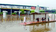 A flooded bus stop outside Seelampur Metro station.