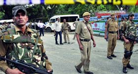 Security personnel stand guard outside the Delhi High Court in New Delhi on Wednesday.