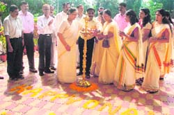 Uttarakhand Governor Margaret Alva lights a lamp on the occasion of Onam in Dehradun 