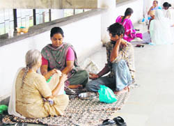 In the absence of restrooms, attendants of patients are forced to sit and eat on the floor at Guru Nanak Dev Hospital in Amritsar