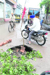 A portion of Daba road that caved-in following heavy rain in Ludhiana 