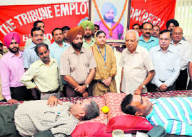 Members of The Tribune Employees Union donate blood on the 113th death anniversary of Tribune Trust founder Sardar Dyal Singh Majithia in Chandigarh on Friday. 