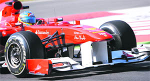 Ferraris Fernando Alonso takes a curve during the free practice session for the Italian GP at the Monza circuit on Friday. 
