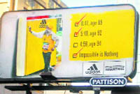 A billboard (L) showing marathoner Fauja Singh endorsing  Adidas shoes  