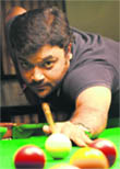 Pranav Jain aims a shot during a snooker quarterfinal match in Chandigarh on Saturday. 