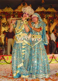 Members of a group from Vrindavan perform Raslila during Ganesh Mahotsav at Laxmi Nagar in east Delhi on Saturday