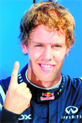 Red Bulls Sebastian Vettel celebrates in the parc ferme after grabbing pole in Monza on Saturday