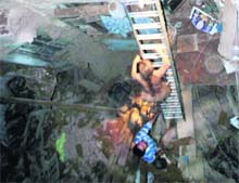 Victims being rescued from the debris of a house at Phullan Wallan Chowk, which collapsed on Saturday night in Amritsar.