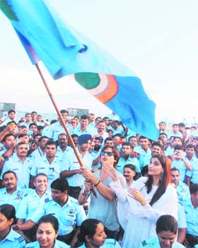 Shahid Kapoor and Sonam Kapoor, lead actors of upcoming film Mausam, wave a flag of the Indian Air Force during their visit to the Chandigarh Air Force Station on Sunday