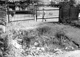 A caved-in road on the entrance to a park in Sector 20