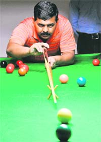 Ajay Singla plays a shot during the final match of the Chandigarh Club Amateur Snooker Tournament on Sunday