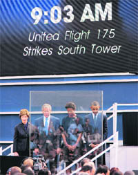 From right: US President Barack Obama, his wife Michelle Obama, US ex-President George W. Bush and his wife Laura Bush observe silence at the time the second plane crashed into the WTC on September 11, 2001, at Ground Zero in New York on Sunday
