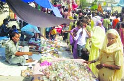 Vendors sell ornaments and other items at the Sodal Mela in Jalandhar.