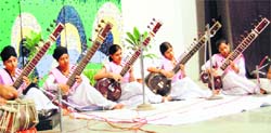 Students playing the sitar during a talent hunt programme at the SR Government College in Amritsar on Monday. 